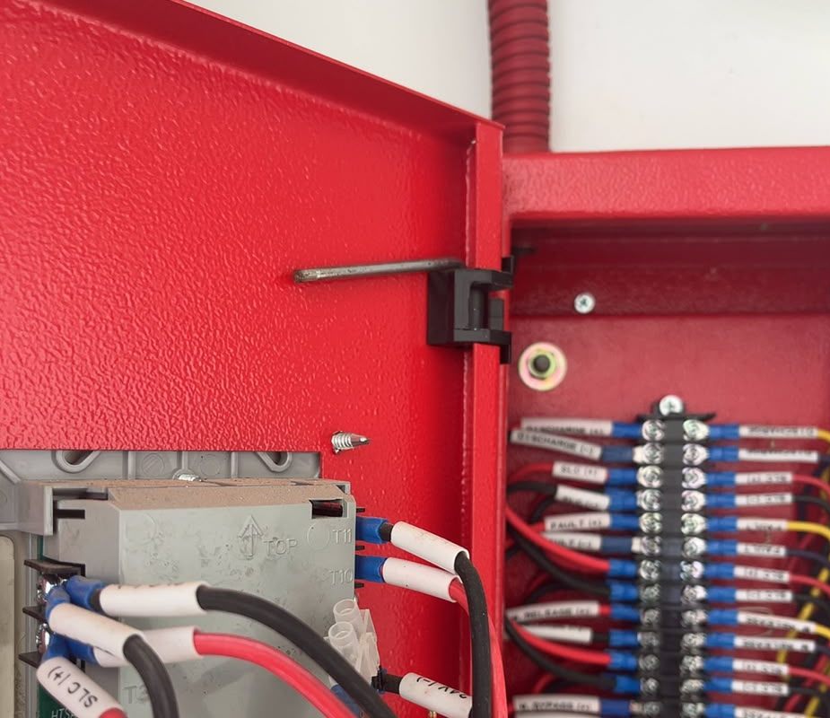 Labelled terminals inside a fire alarm panel