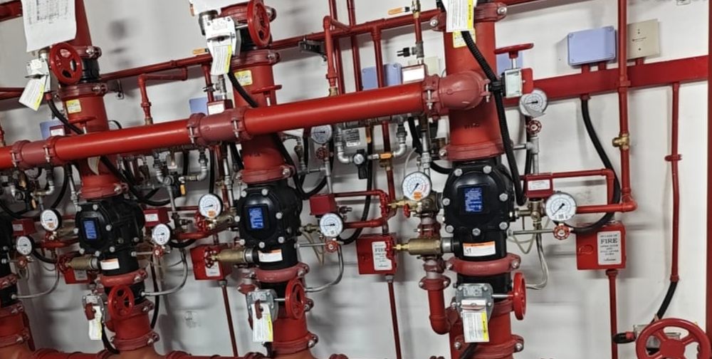 Completed deluge valve station with tagged valves and zone drawings